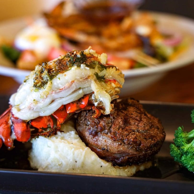 PoPo Family Restaurant's surf and turf with lobster tail, steak, mashed potatoes, and broccoli.